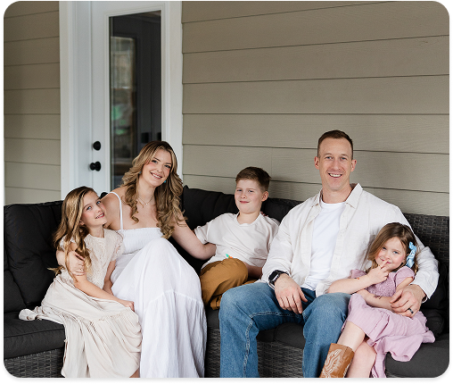 Family on outdoor sofa